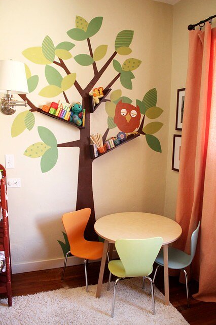 Painted tree with integrated bookshelves design reference